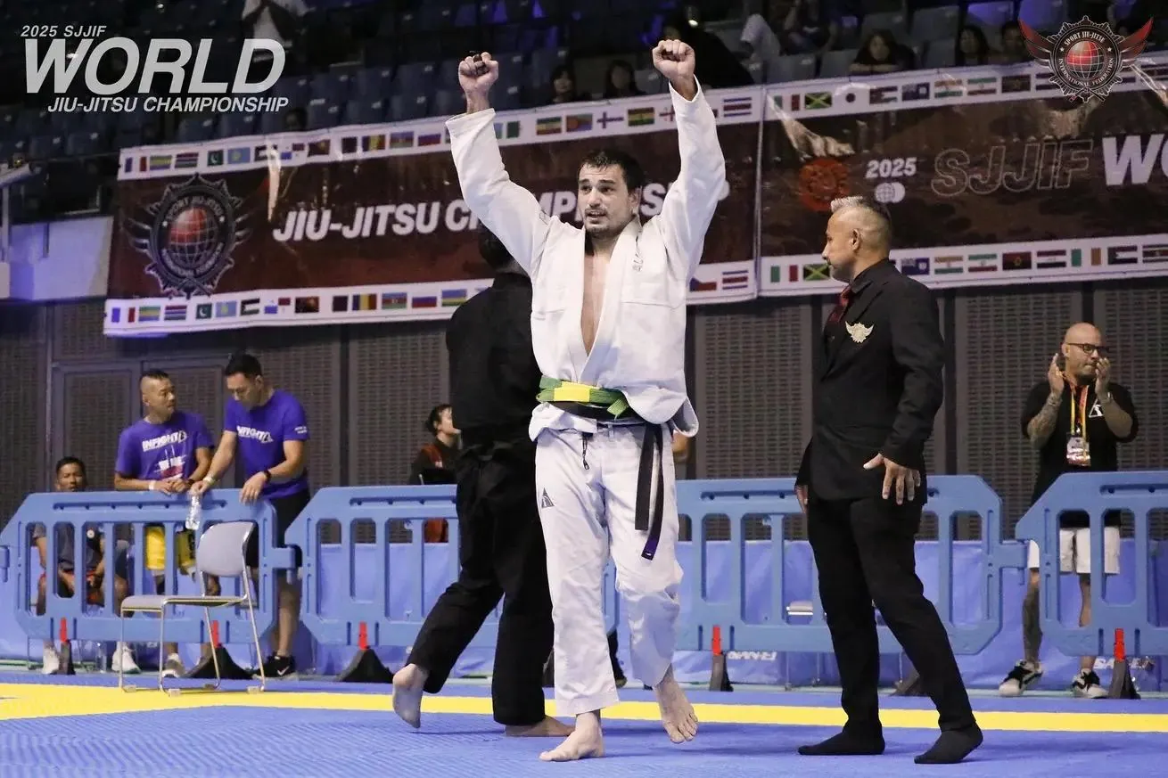 Spiro Kovac raising both fists after a win at the 2025 SJJIF World Jiu-Jitsu Championship